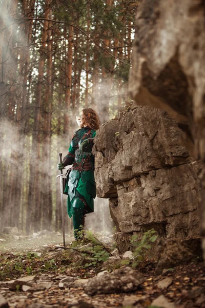 Elf woman in green leather armor with the sword — Stock Photo, Image