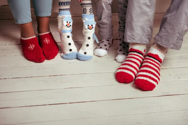 Big family of father, mother, sister, brother in Christmas socks — Stock Photo, Image