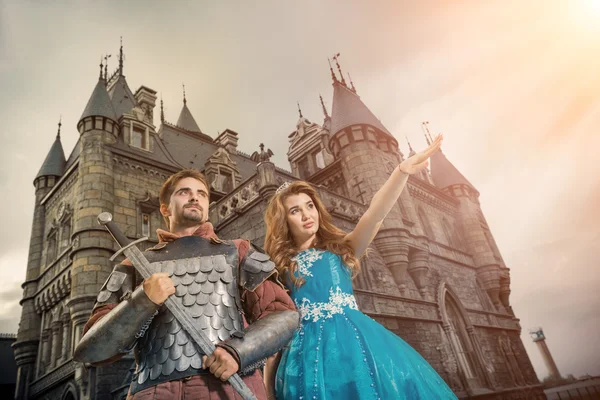 Beautiful princess is showing something to her brave knight — Stock Photo, Image