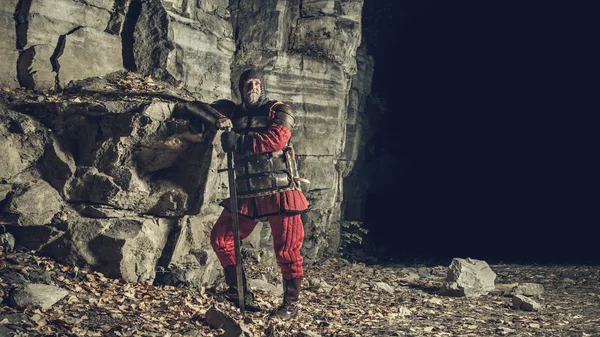 Old medieval King in armor with sword — Stock Photo, Image