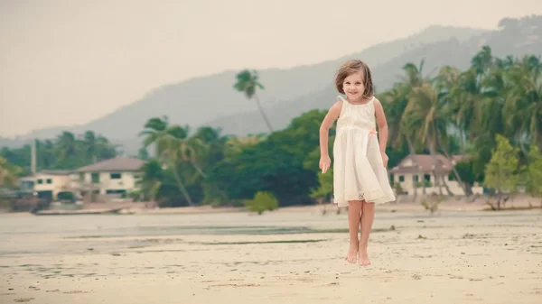 Young happy girl in white dress. — Stock Photo, Image