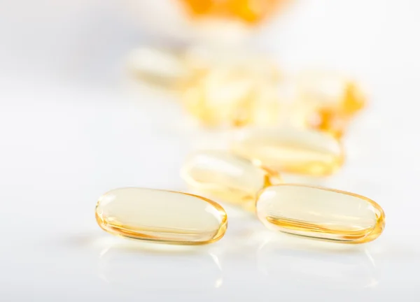 Shiny yellow vitamin e — Stock Photo, Image