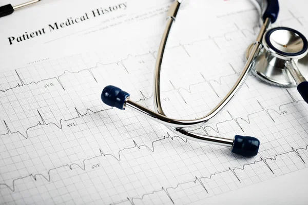 Stethoscope on paper cardiogram — Stock Photo, Image