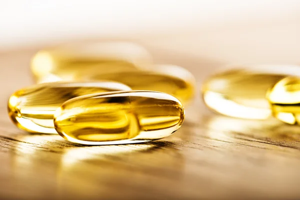 Shiny yellow vitamin e — Stock Photo, Image