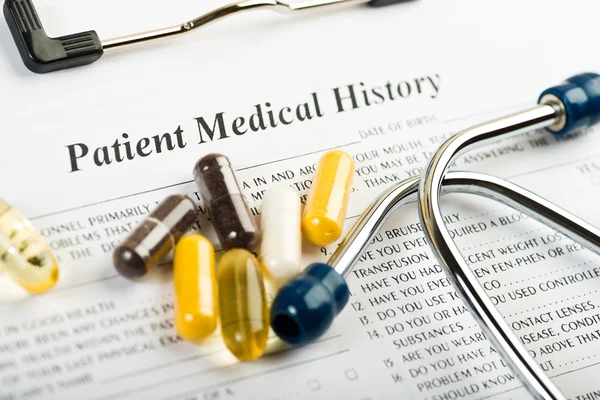 Medical history document with medicine — Stock Photo, Image