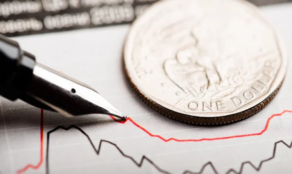 Dollar coin on fluctuating graph — Stock Photo, Image