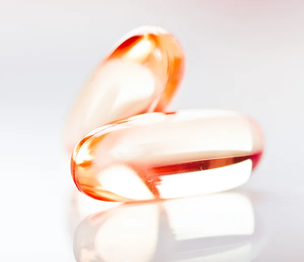 Vitamine e vissen olie capsules — Stockfoto