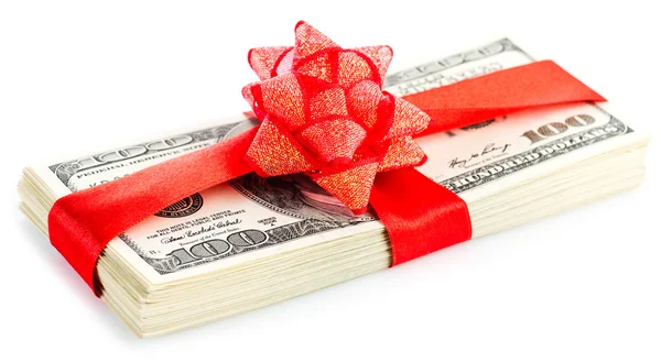 Stack of dollars with red bow — Stock Photo, Image