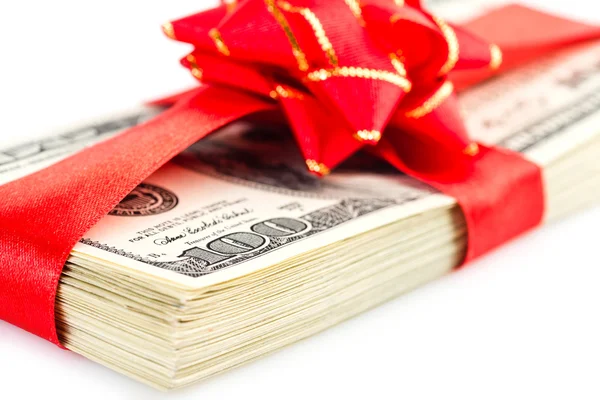 Stack of dollars with red bow — Stock Photo, Image