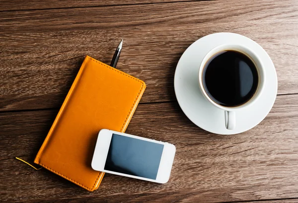 Organizer with cup of coffee — Stock Photo, Image