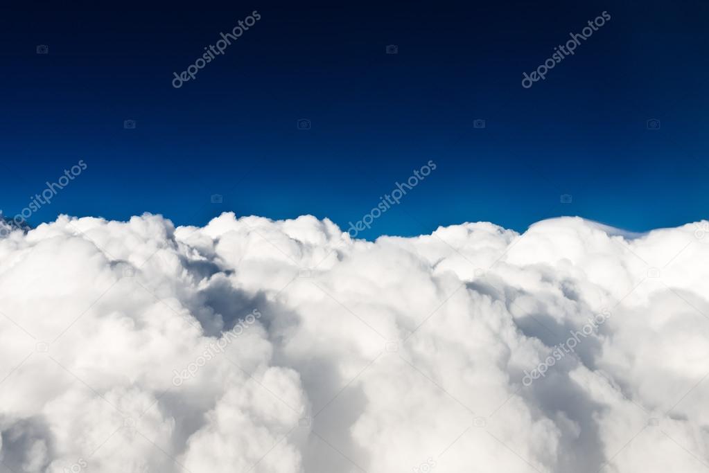 Above white clouds
