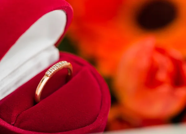 Diamond ring in a velvet red box — Stock Photo, Image