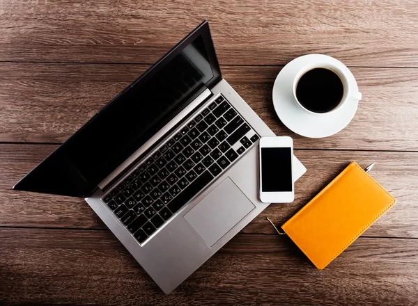 Workplace with laptop, mobile smartphone and coffee — Stock Photo, Image