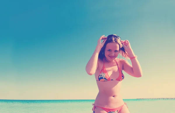 Girl in orange swim suite — Stock Photo, Image