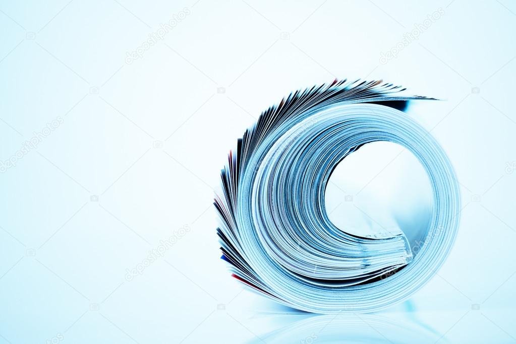 Magazine roll on blue background
