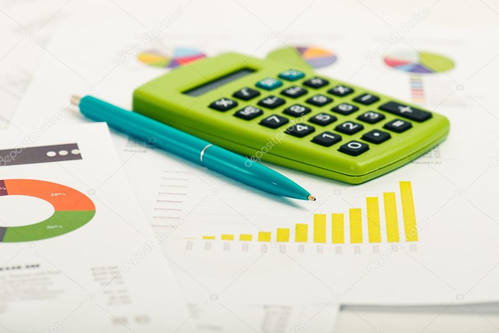 Financial papers, calculator and pen