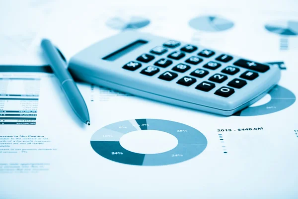 Pen and Calculator on a paper — Stock Photo, Image