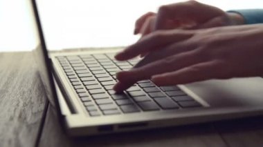 Women's hands typing on computer
