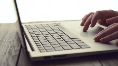 Woman Scrolls a Website
