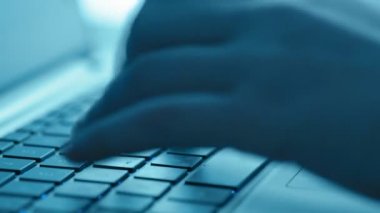 Women's hands typing on computer