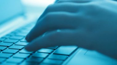 Women's hands typing on computer