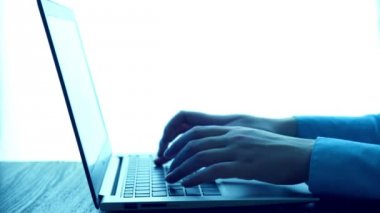 Women's hands typing on computer
