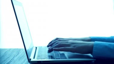 Women's hands typing on computer