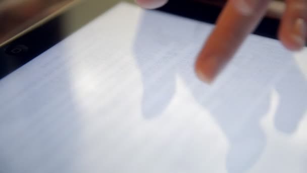 Woman reading bible on tablet — Stock videók