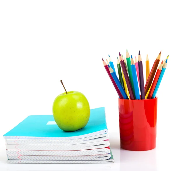 Notebooks, pencils and apple — Stock Photo, Image