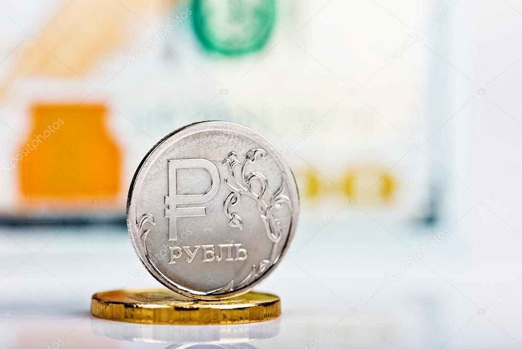 Russian ruble coin against dollars