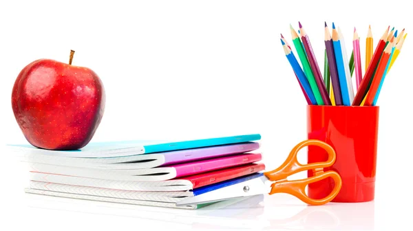 Notebooks, pencils and apple — Stock Photo, Image