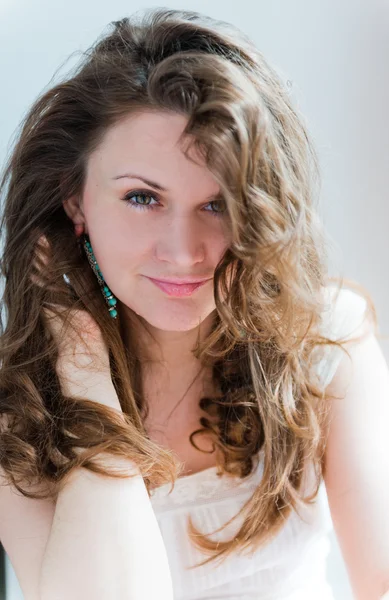 Young woman with long curly hair — Stock Photo, Image