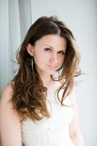 Young woman with long curly hair — Stock Photo, Image