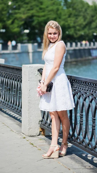 Blond woman in a white dress outdoors — Stock Photo, Image