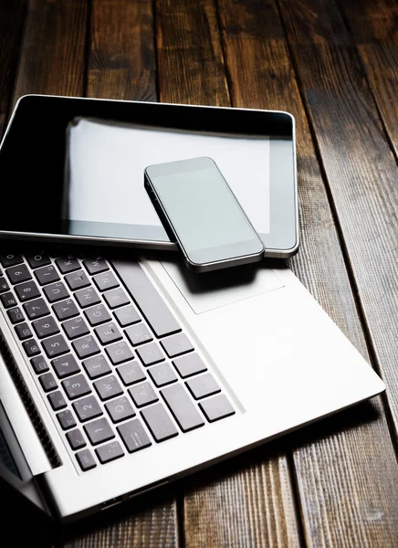 Laptop with phone and tablet — Stock Photo, Image