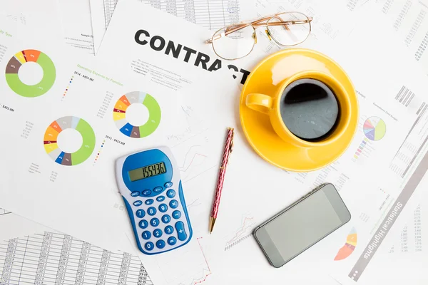 Workspace with booklet and graphs — Stock Photo, Image