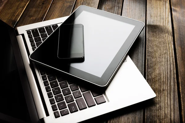 Laptop with phone and tablet pc — Stock Photo, Image