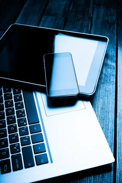 Laptop with phone and tablet pc — Stock Photo, Image