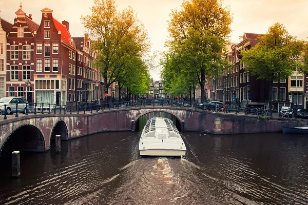 Amsterdam canals with boat — Stock Photo, Image