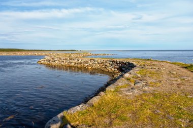 Dam to the island Muksalma, Solovetsky archipelago, Russia clipart