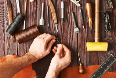 Man working with leather  clipart