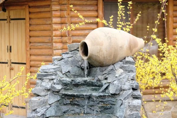 Garden waterfall with stone jar — Stock Photo, Image