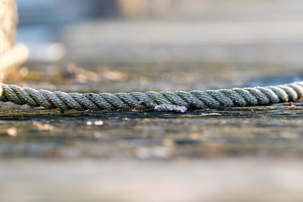 Rope on wooden jetty