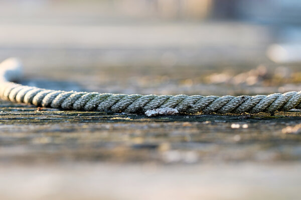 Rope on wooden jetty
