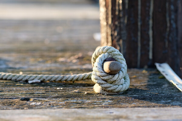 Rope on wooden jetty