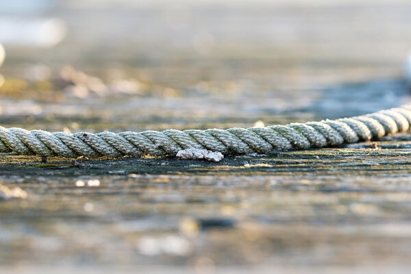 Rope on wooden jetty