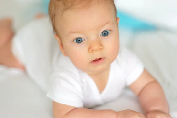 baby crawling in bed