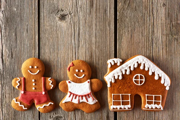 Christmas gingerbread couple and house cookies — Stock Photo, Image