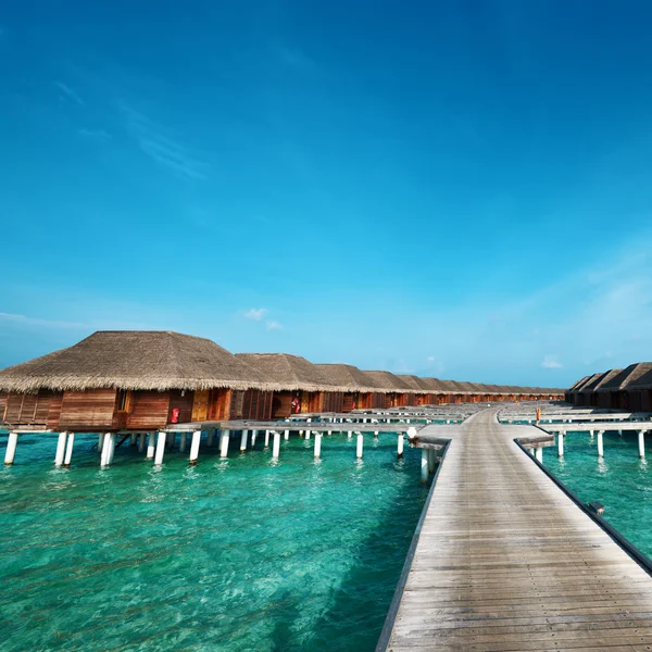 Beautiful beach with water bungalows — Stock Photo, Image