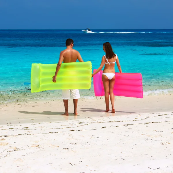 Couple with inflatable rafts — Stock Photo, Image